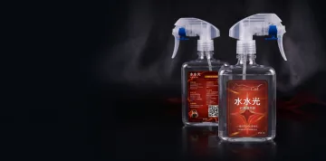 Front and back views of red Shyne bottles